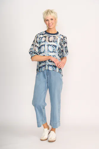 Model wearing Denim Floral Check Leopard Rib Trim Blouse By Memo Available at Beetees Nelson